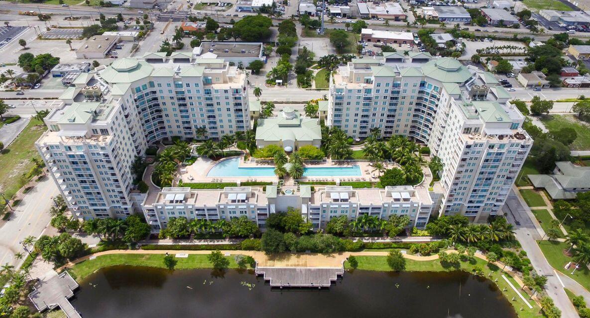 Great location of this fantastic 2/2 condo with volume ceilings, laminate flooring throughout, kitchen with European style cabinetry, granite counters with breakfast bar, stainless steel appliances. Amenities galore including sauna and steam room, 2 swimming pools, fitness center, social room, business center. Boynton beach marina, restaurants and area shops are just steps away. Beach is in walking/biking distance