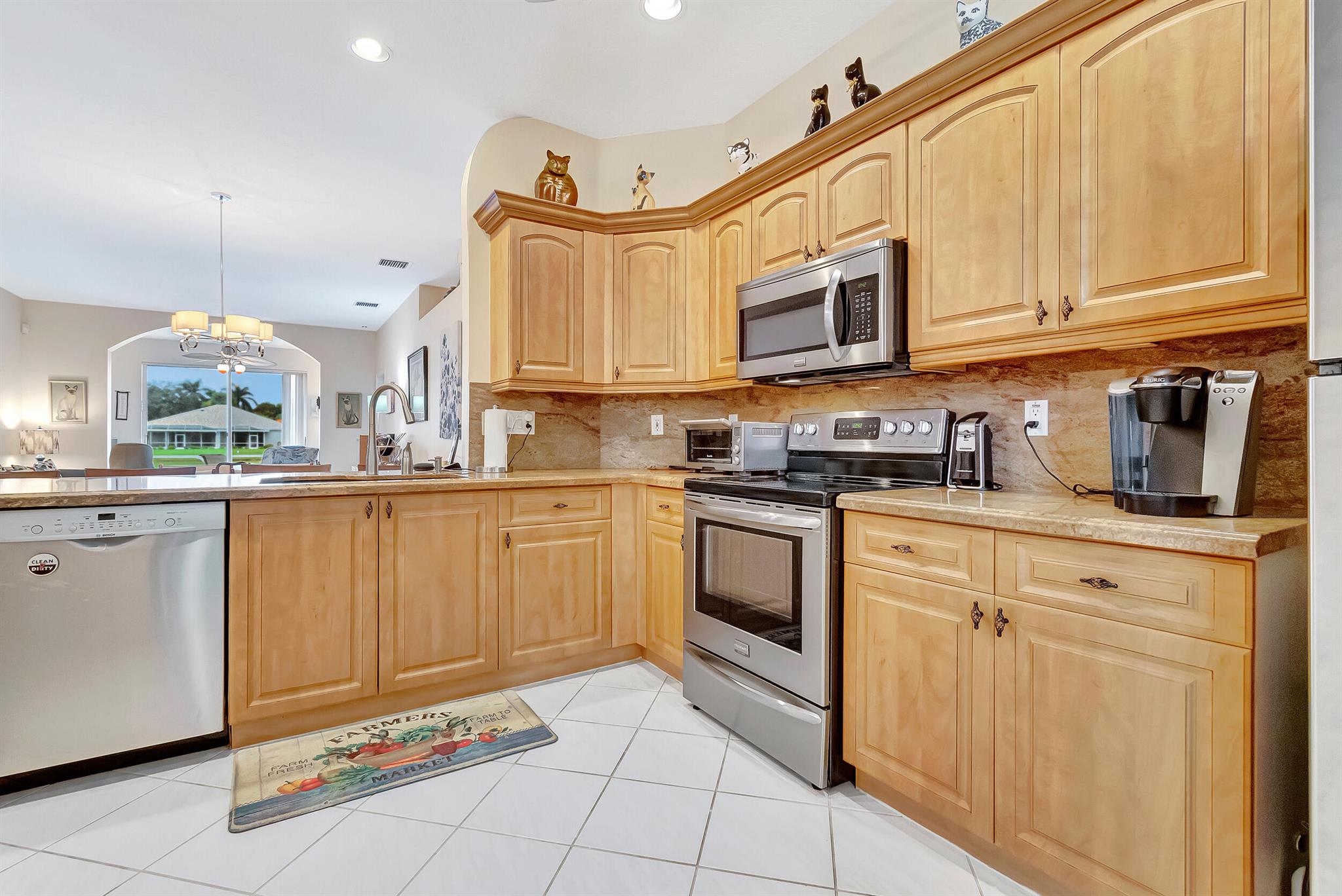 This stunning villa boasts a breathtaking view of the center lake. The remodeled open kitchen is equipped with stainless steel appliances, and the countertops feature complete granite backsplash, two sinks, and a spacious pantry. The master bedroom is bright airy and has a fantastic view of the lake. It also features a large walk-in closet, a master bathroom with two sinks, a step-down shower stall, and a linen closet. The house is secured with accordion shutters throughout, and there are no popcorn ceilings. The laundry room is spacious, and the tile flooring is diagonal throughout the house except for the two bedrooms.Additionally, the two-car garage features a slop sink. The Florida room offers an exceptional view of the lake. The community of Majestic Isles is pet-friendly so you ..