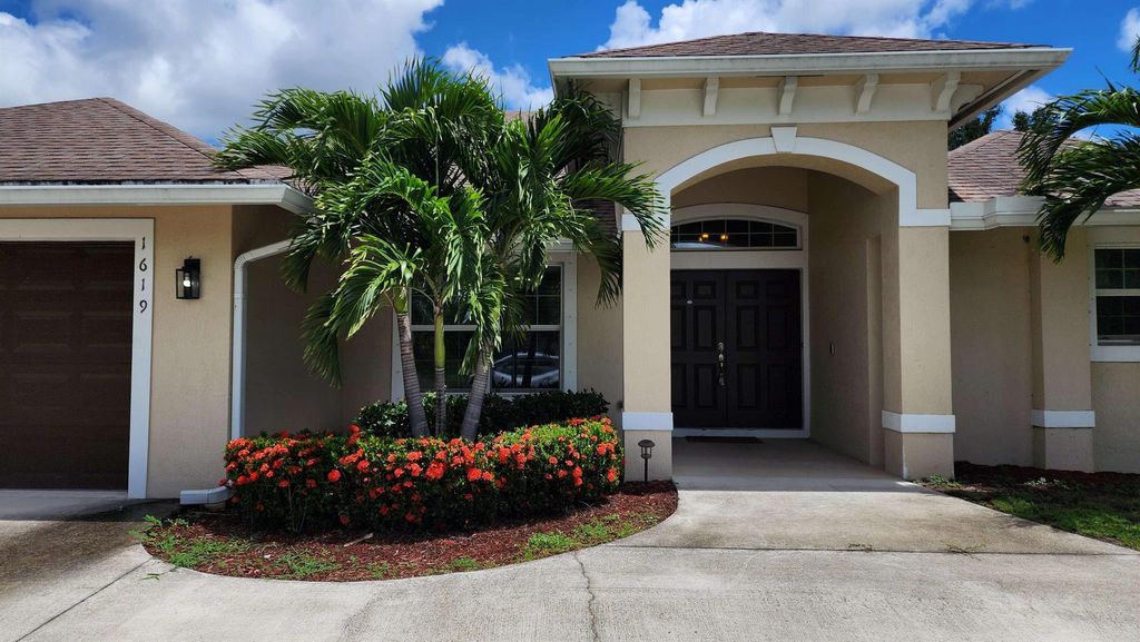 Photo of 1619 SW Escobar Lane, Port Saint Lucie, FL 34953 (MLS # R11074453)