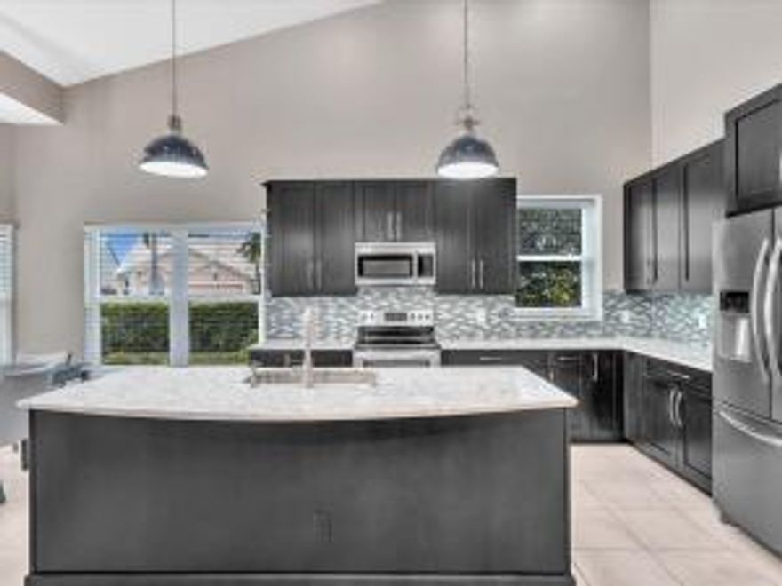 Beautiful Seasonal Rental in Aberdeen Country Club comes with Social membership. Open Floor Plan with Vaulted/High Ceilings with fans throughout. 3 BR 2 Bath .  This inviting fully-furnished home has formal LR/DR, triple play is covered, screened and tiled lanai overlooking a private backyard. Spacious Kit w/tall ESPRESSO cabinets, island and granite countertops. Generously stocked for gourmet meals and entertaining. Sunny eat-in kit table. Kit is open to family rm with an 85'' TV with plenty of seating. Tranquil Primary Bedroom has a king size tempur-pedic mattress w/ adjustable frame and massage WIC/DBL Closet has built-in organizers. Primary bath has a remodeled walk-in-shower, dual sinks w/ make-up table. BR2 Queen, BR3 Daybed & workstation. Gated friendly community.