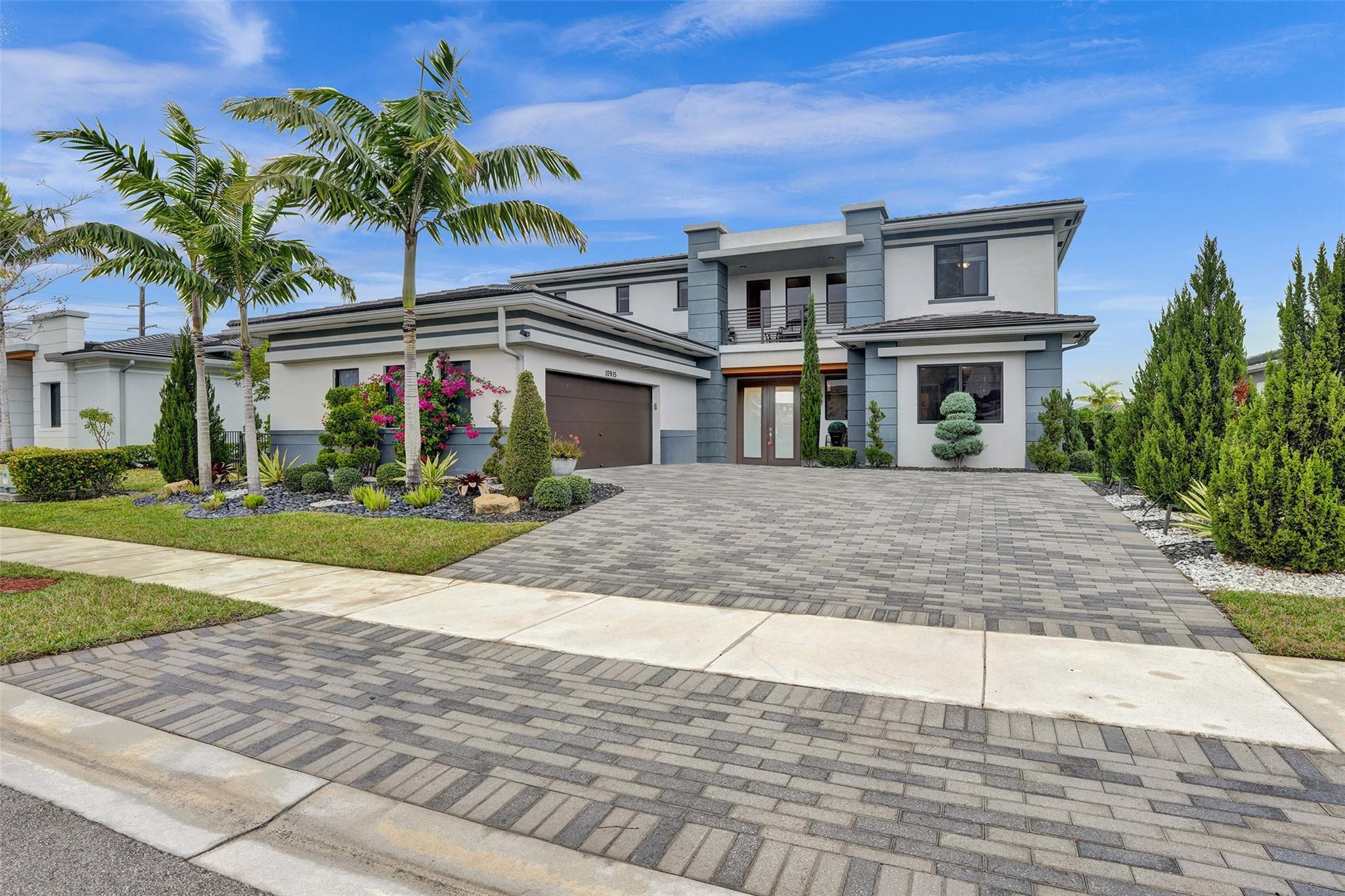 Contemporary stunner with upgraded exterior desired with 5 bedrooms and 5.5 baths, grand entrance with 22 feet ceilings and sweeping staircase. This stunning Silverstone model with attached Casita suite/in law (2 rooms, full bath and separate entrance), is situated on desirable Presidential collection within beautiful Cascata. No expenses spared ($300K+)on this lakefront pool beauty, with custom outdoor living, outdoor kitchen/pergola with pool and spa with waterfall feature and elegant landscaping. The home is built to entertain with an extensive kitchen and family room combination with rich cabinetry. All the bedrooms are en-suites. Club house and Sportsplex, indoor and outdoor basketball, resort style pools , gyms. $10,000 towards closing cost or points buydown.