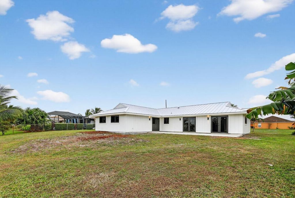 Photo of 617 SE Whitmore Drive, Port Saint Lucie, FL 34984 (MLS # R11138839)