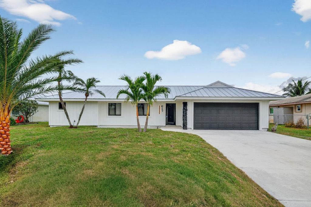 Photo of 617 SE Whitmore Drive, Port Saint Lucie, FL 34984 (MLS # R11138839)