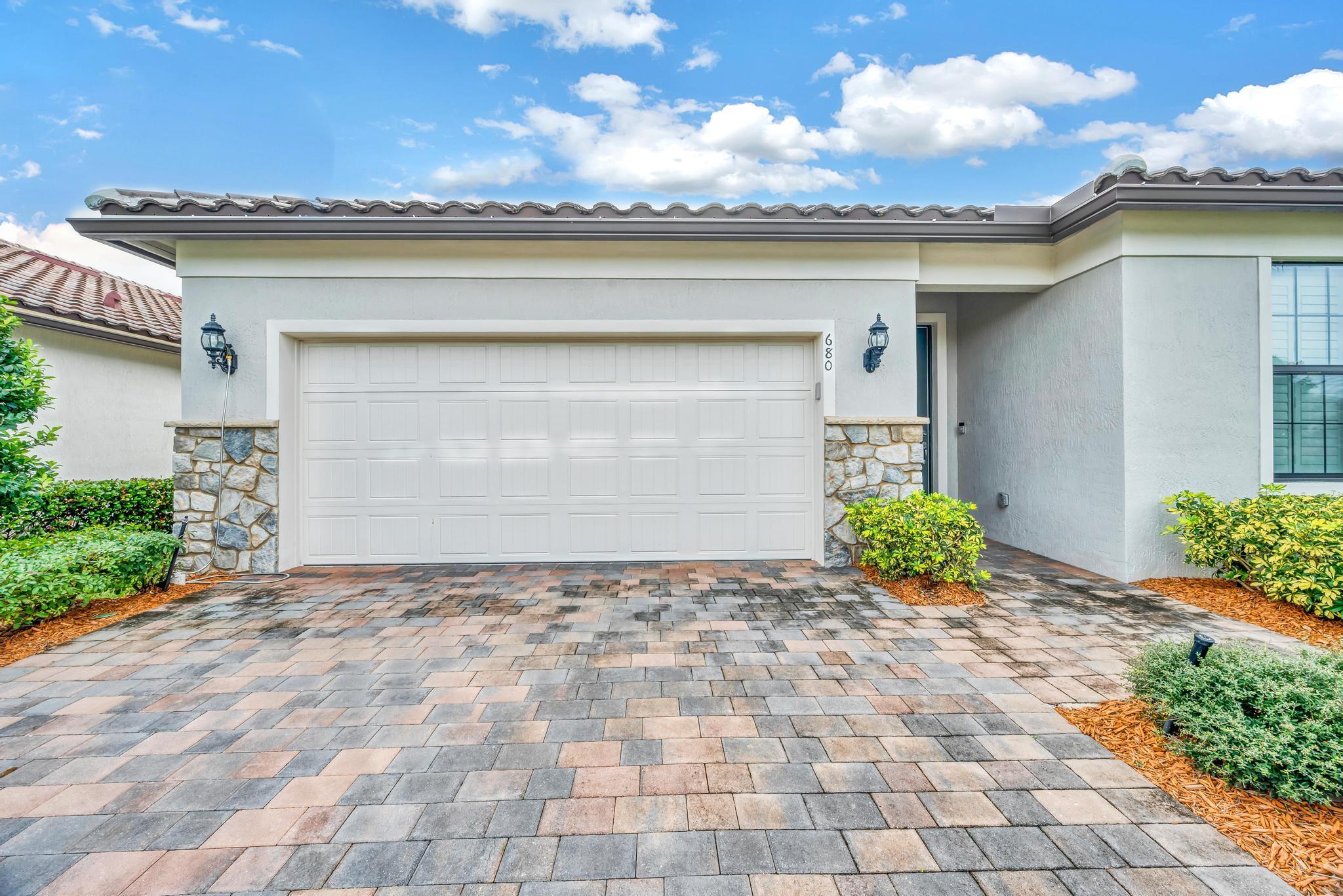 Spacious 3 bed/ 2 bath/ 2 car garage home in Gated Community of VERANDA GARDENS, featuring Resort-Style Amenities. Discover this beautiful home with OVERSIZED backyard, tranquil canal views, offering both privacy and serenity. Property features: Elegant tile flooring, updated kitchen and bathrooms with quartz countertops and modern finishes and GAS STOVE! IMPACT windows for safety and energy efficiency, Plantation shutters, adding style and privacy. Amenities: Resort-style pool and lap pool, Tennis and pickleball courts, Fully equipped gym; Conveniently located just 3 minutes from Turnpike and 10 minutes from I-95. Short 15-minute drive to Stuart and Palm City. Enjoy a blend of luxury, convenience & comfort in this amazing home!