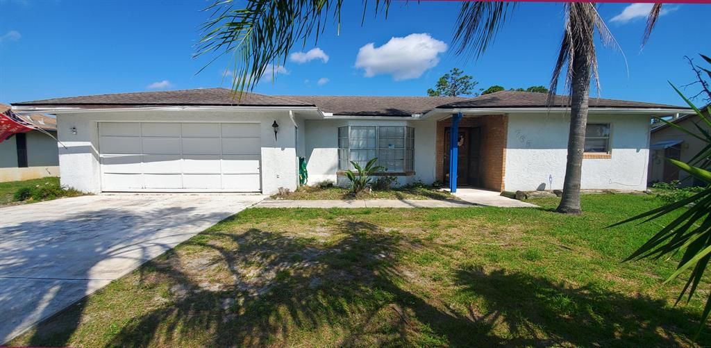 Photo of 765 SE Norcross Avenue, Port Saint Lucie, FL 34983 (MLS # R10695014)