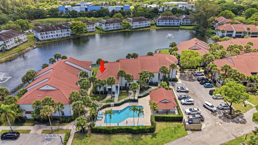 Completely updated 2BR/2BA lakefront condo with tranquil water views. The kitchen features quartzite counters and backsplash, a modern sink and faucet, white cabinetry with designer hardware, custom lighting, stainless steel appliances, and impact windows throughout. Newer A/C, hot water heater, and flooring throughout. The spacious primary suite, along with updated bathrooms—each featuring a glass shower—will make you feel right at home. The community pool is just steps from your front door. PGA National Resort & Spa is a gated community located minutes from world-class shopping, dining, beaches, and, of course, golf.