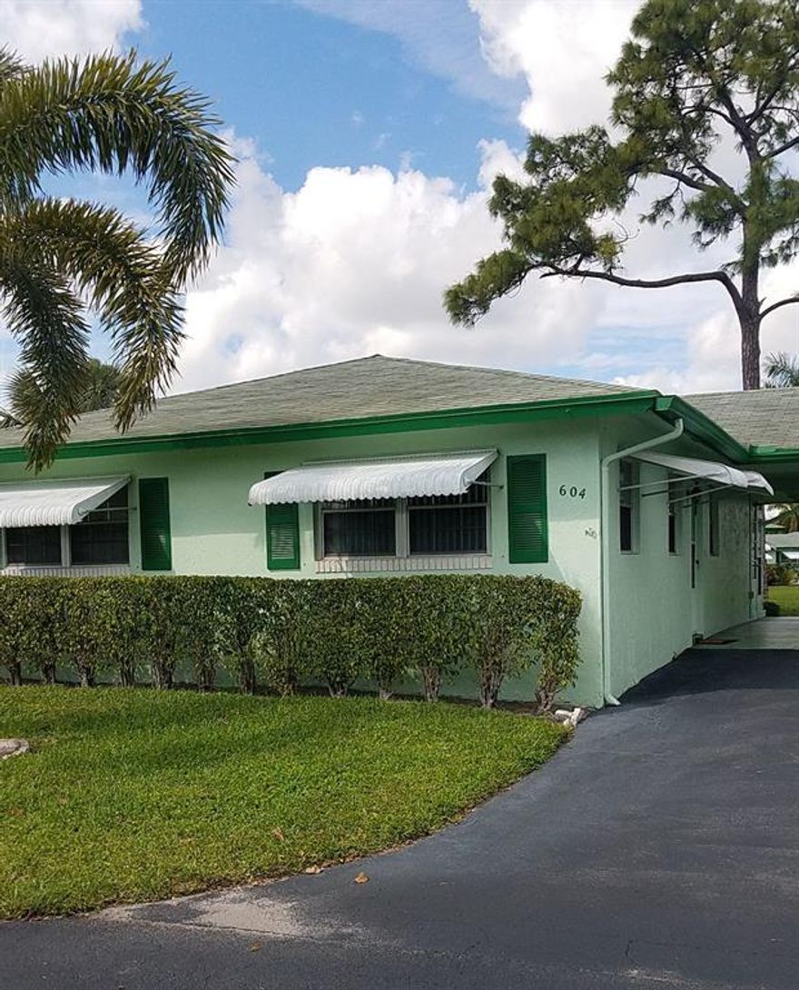 MOTIVATED SELLER....GET AWAY FROM THE COLD AND INTO THE FLORIDA LIFESTYLE. THIS SPACIOUS, LIGHT & BRIGHT 2 BEDROOM 2 BATH VILLA IS LOCATED IN AN INTERIOR CIRCLE WITH EXTENSIVE POOL & GREEN VIEWS.Roof about 6 years old & air conditioner 6 years too! THE VILLA IS EXTENDED WITH A FLORIDA ROOM & HAS TILED FLOORS IN LIVING AREAS & NEWER APPLIANCES, MASTER BEDROOM HAS AN EXTRA CLOSET. WASHER/DRYER IN SEPARATE UTILITY ROOM. LOW MAINTENANCE FEE INCLUDES CABLE, WATER, SEWER & MORE. COUNTRY MANORS IS A 55+ COMMUNITY WITH 8 POOLS AND IS IMPECCABLY KEPT. CAN BE SOLD WITH FURNITURE OR WITHOUT. 6 MILES TO BEACH AND LIVELY DOWNTOWN DELRAY. SPECIAL FINANCING AVAILABLE. Sq ft is larger due to enclosed florida room. Builders Sq Ft is 1227 sq ft according to floor plan.