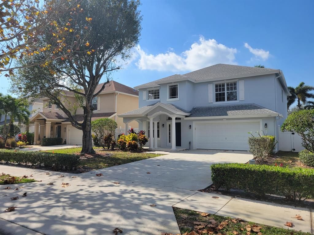 Photo of 330 Clocktower Drive, Jupiter, FL 33458 (MLS # R10864347)