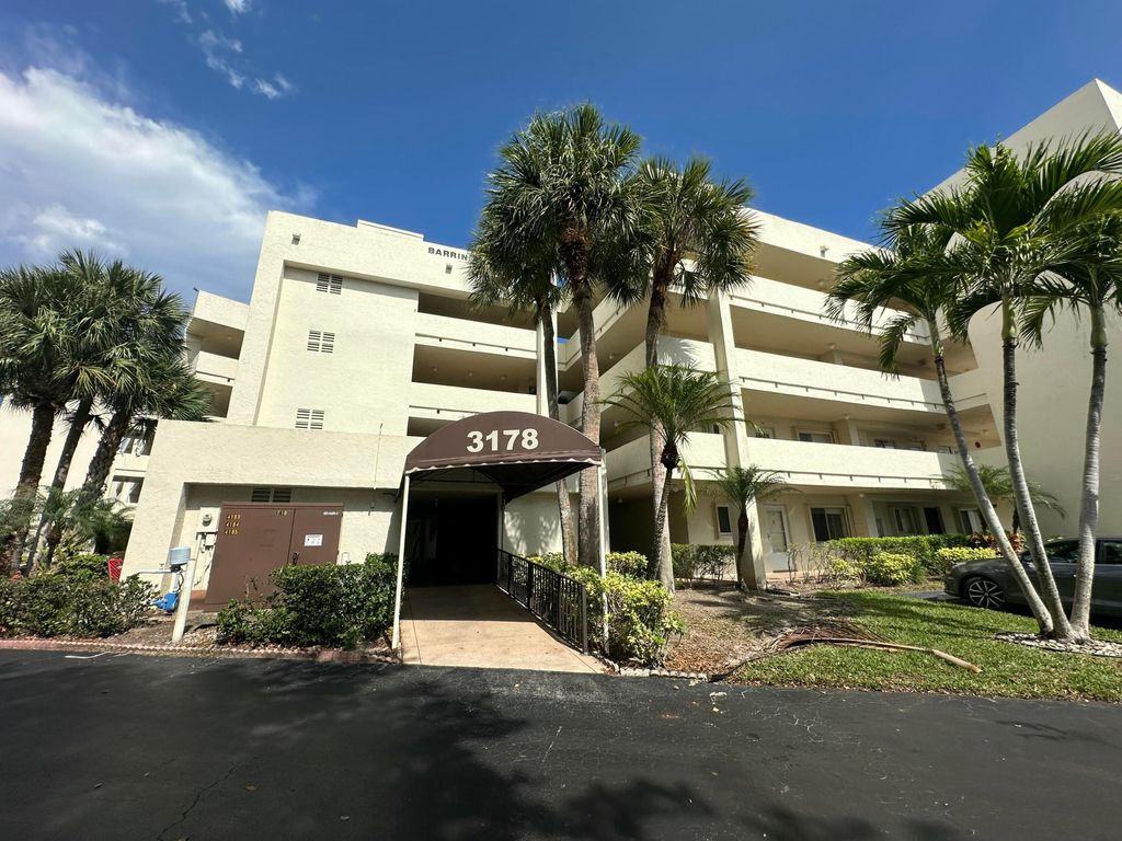 Photo of 3178 Via Poinciana Dr #307, Greenacres, FL 33467 (MLS # B26002919)