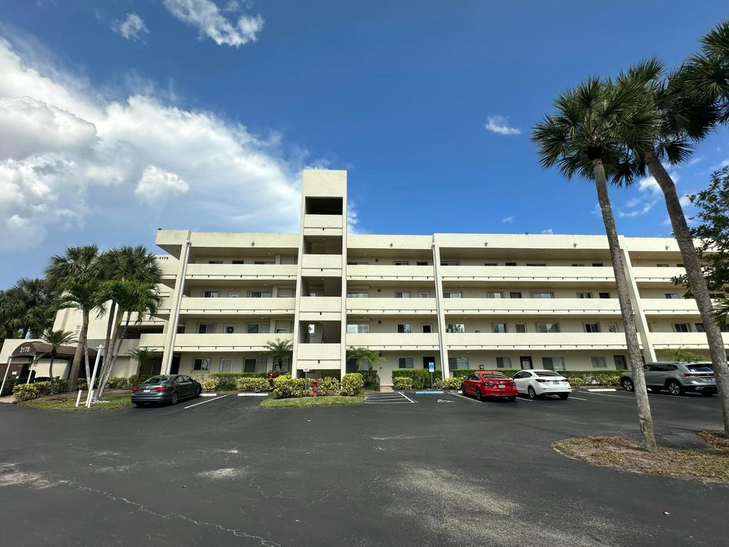 Photo of 3178 Via Poinciana Dr #307, Greenacres, FL 33467 (MLS # B26002919)