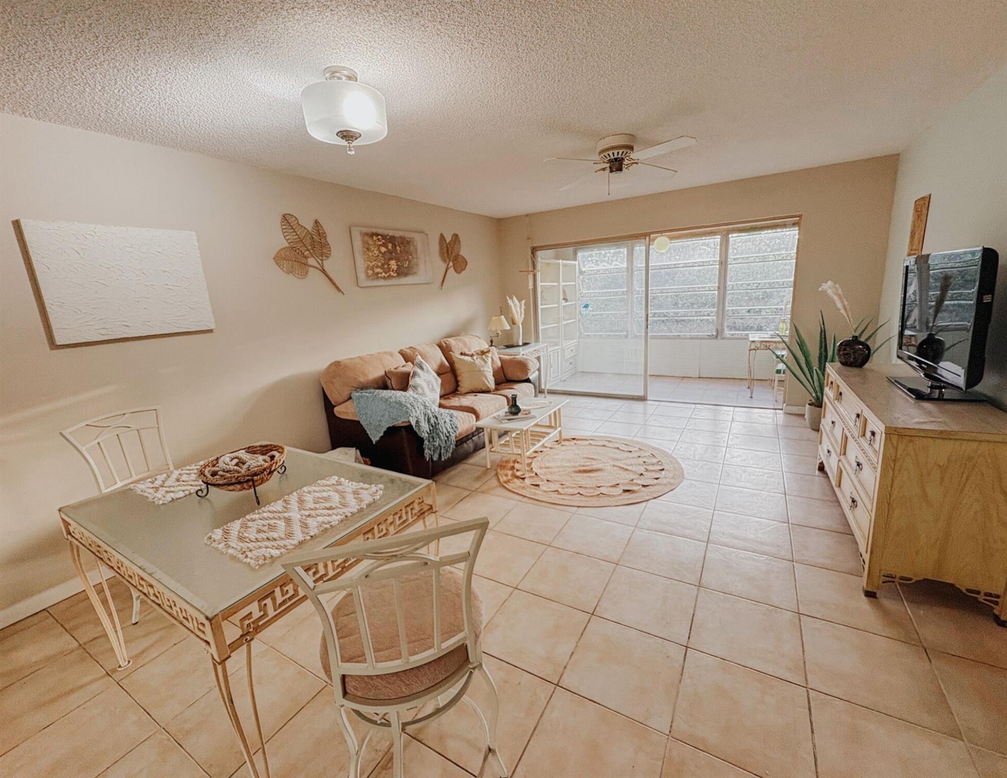 AFFORDABLE living with WATER VIEWS, vintage charm, and room to make it yours! This spacious 1 bed, 1.5 bath unit in a peaceful 55+ community features an enclosed FLORIDA ROOM with charming vintage casement windows, offering tranquil canal views and tons of natural light!! Enjoy a spacious kitchen with extended cabinetry and a bonus countertop—perfect for a coffee station or breakfast bar, a convenient guest half bath, and a generous primary suite with walk-in closet, oversized vanity top and a bathing tub with a sliding glass door. Desirable third-floor unit with elevator access, plus laundry and trash chute steps away! Community offers reserved parking, guest spots, spacious community pool, and LOW HOA fees! PRICED TO SELL—bring your vision and make it home!!