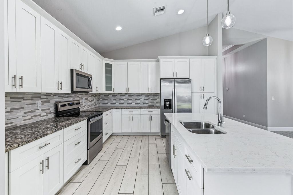 Photo of 1925 SW Michelangelo Avenue, Port Saint Lucie, FL 34953 (MLS # B26023403)