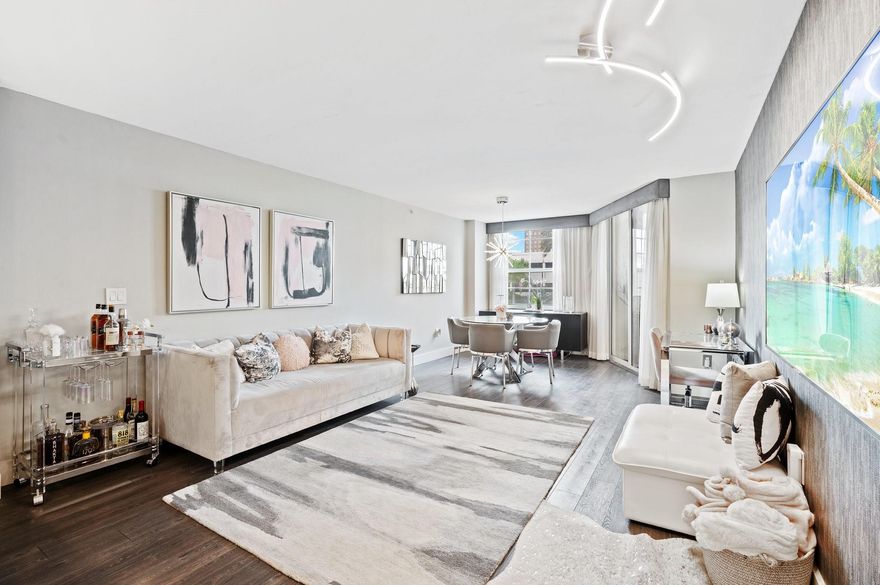 This gorgeous totally upgraded fully furnished oversized condo located in the heart of Downtown and well sought Las Olas by the River features designer finishes throughout.  Open Kitchen with quartz countertops, custom cabinetry & SS appliances. The spacious bedroom includes a custom walk-in closet and plenty of room to add an office. Stunning bathroom with separate seating, fully length mirrored medicine cabinet, built in linen closet & tub/shower with glass enclosure. Separate cute private interior patio. Washer & Dry in unit.  So many upgrades.  Must see in person. Seller paid for elevator and roof assessments.  Secured, pet friendly building with 5 Star Resort amenities & 24 hr concierge. Right on the River across from famous Las Olas & minutes to Fort Lauderdale Beach & Airport.