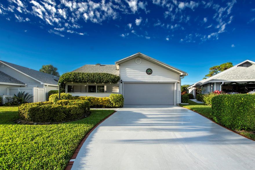 Discover this inviting 2-bed, 2-bath home w/den & 2-car garage. The kitchen boasts white cabinets, Corian countertops, stainless steel appliances, w/ a tiled backsplash. The spacious great room combines the living & dining areas. The master suite features a granite vanity & a sizable walk-in tiled shower. The office showcases wood-like tile flooring, while hurricane-resistant windows adorn the front, 2nd bed, & office windows. Revel in the comfort of 3-yr-old carpet throughout. Character abounds w/ numerous shelves & storage options. Step into the large screened lanai w/ beautiful tile flooring & a golf course view. Notable features include high-end blackout pulley curtains, a garage w/ a screened door, & 3 newer skylights equipped w/ shades for customized lighting. Roof-2019, AC-2018