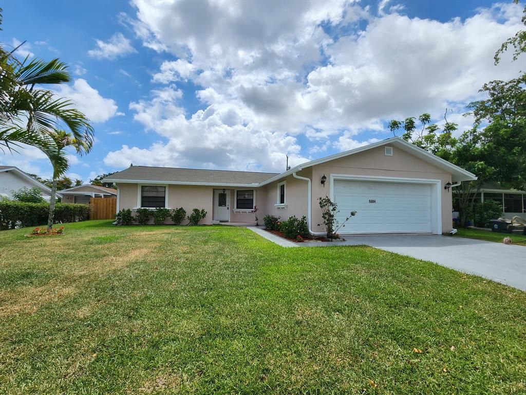 Photo of 6684 N Plymouth Drive, Lake Worth Beach, FL 33462 (MLS # R10887801)