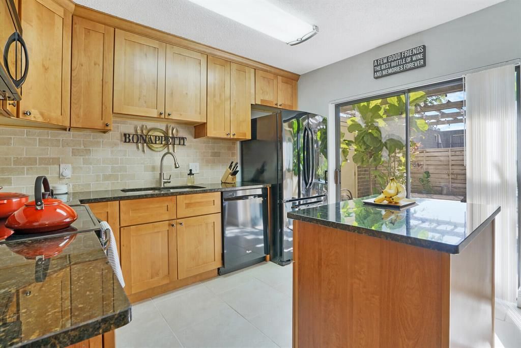 Photo of 901 9th Terrace, Palm Beach Gardens, FL 33418 (MLS # R10763183)