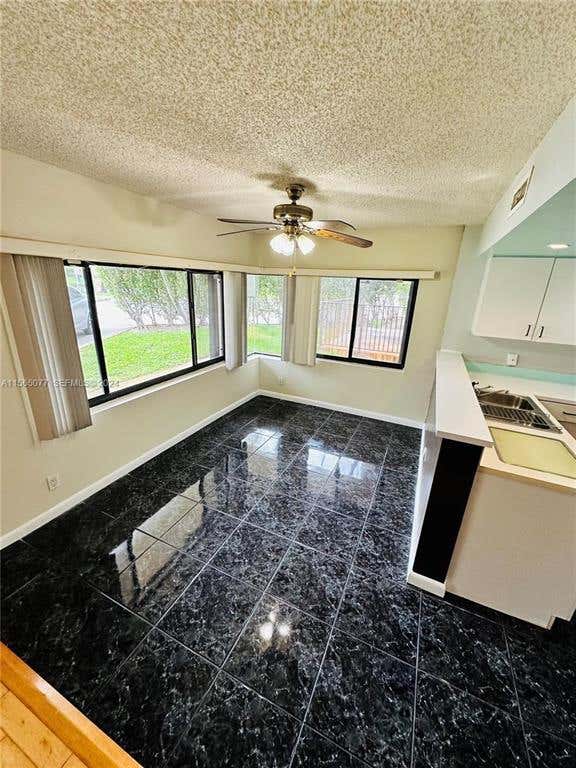 Photo of 4730 SW 62nd Way #104, Davie, FL 33314 (MLS # B26044403)
