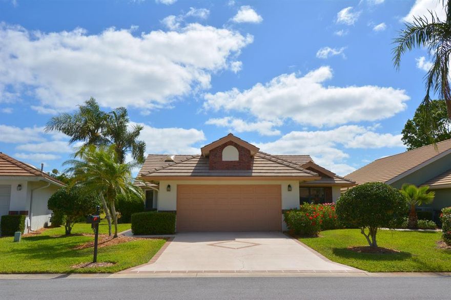 This home offers the best in country club living. A spacious screened lanai, a Florida room, (with a wet bar) looking out at the 3rd hole of St. Lucie Trail, are the highlight of this 3 bedroom, 2 full bath home. All appliances are recent additions (within the last year) as are the water heater and A/C unit. The kitchen cabinets have all been refaced and a new quartz counter top added. The owner is currently putting a new roof on the house, so it is really 'move in ready'.
