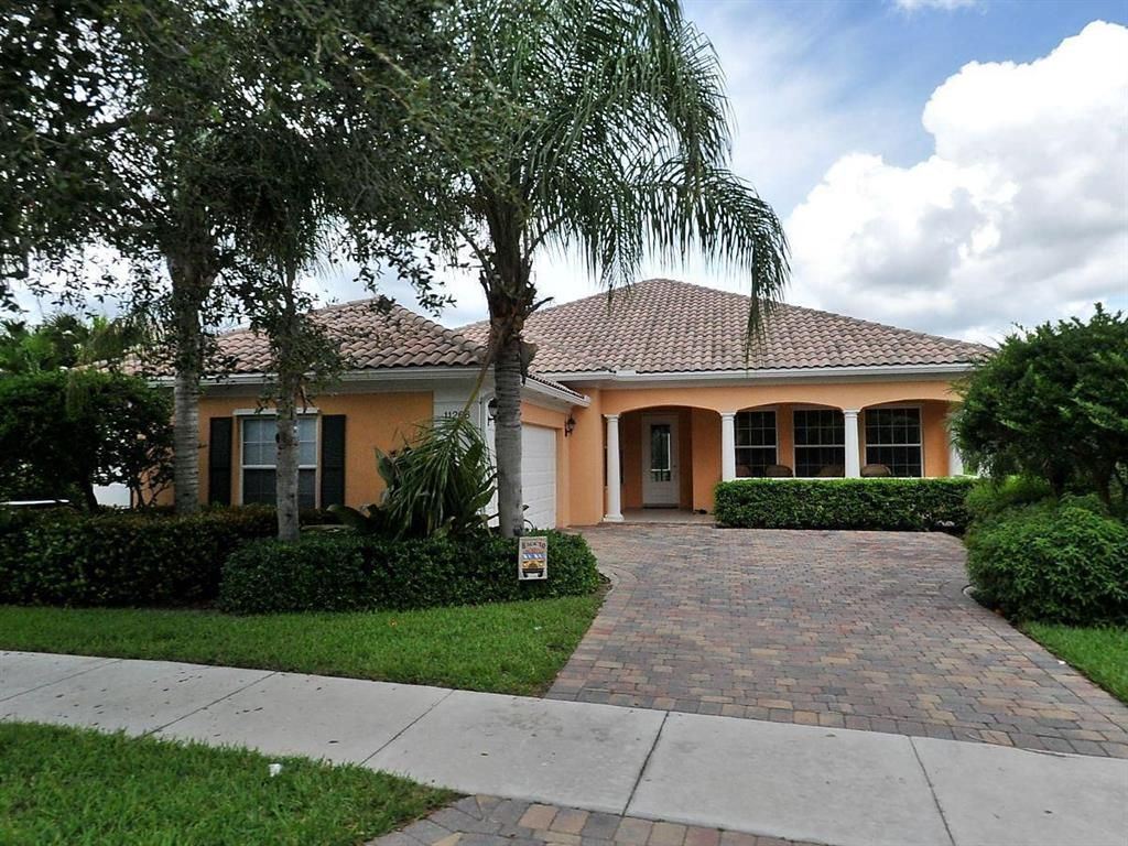 Photo of 11266 SW Olmstead Drive, Port Saint Lucie, FL 34987 (MLS # R10763304)