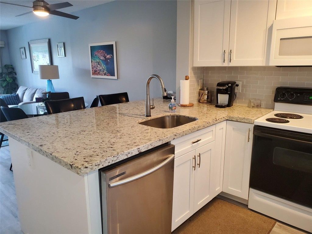 Photo of 2220 N Cypress Bend Drive #405, Pompano Beach, FL 33069 (MLS # F10521319)