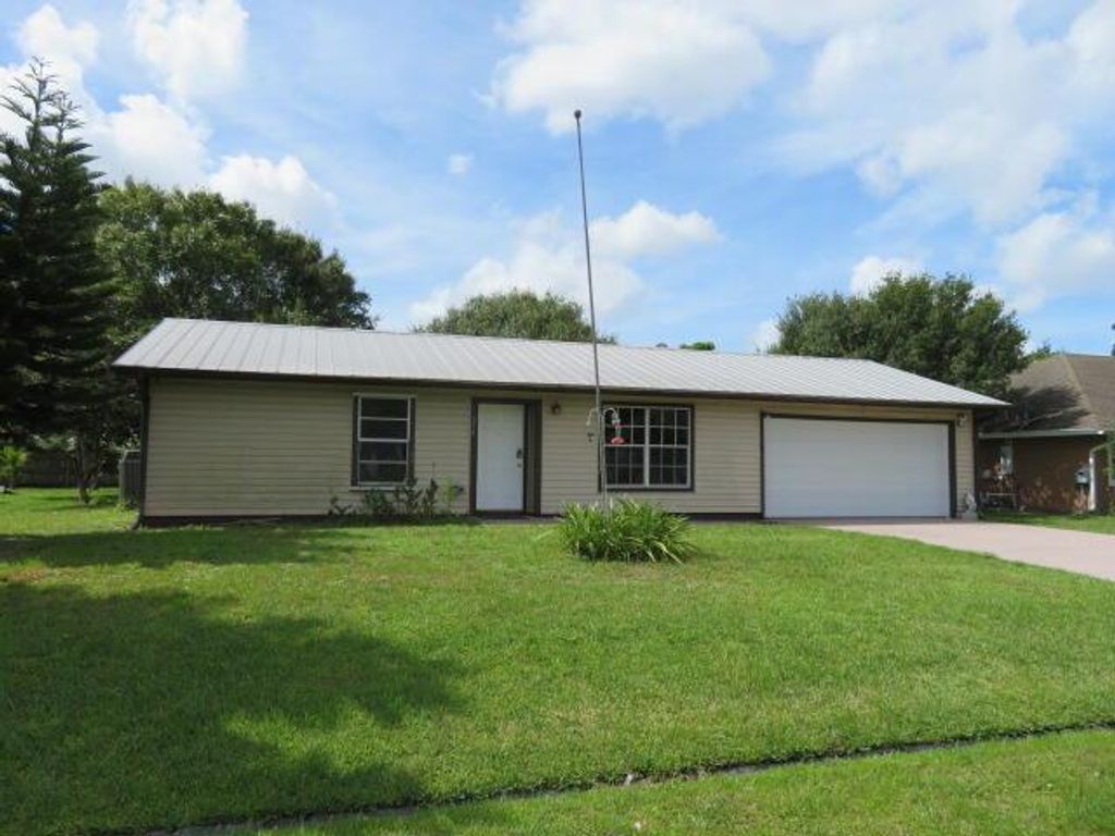 Photo of 574 NW Azine Avenue, Port Saint Lucie, FL 34983 (MLS # R10828396)