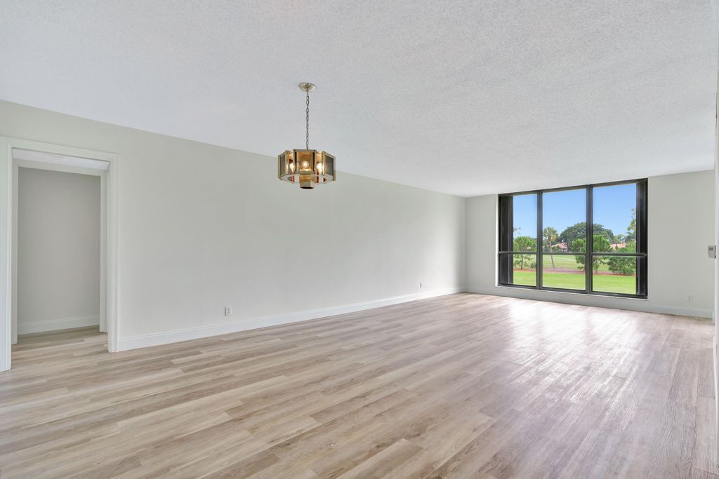 Photo of 5350 Woodland Lakes Drive #208, Palm Beach Gardens, FL 33418 (MLS # R11018347)