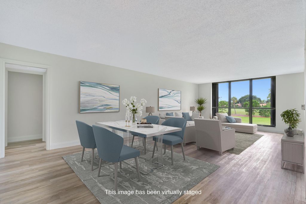 Photo of 5350 Woodland Lakes Drive #208, Palm Beach Gardens, FL 33418 (MLS # R11018347)