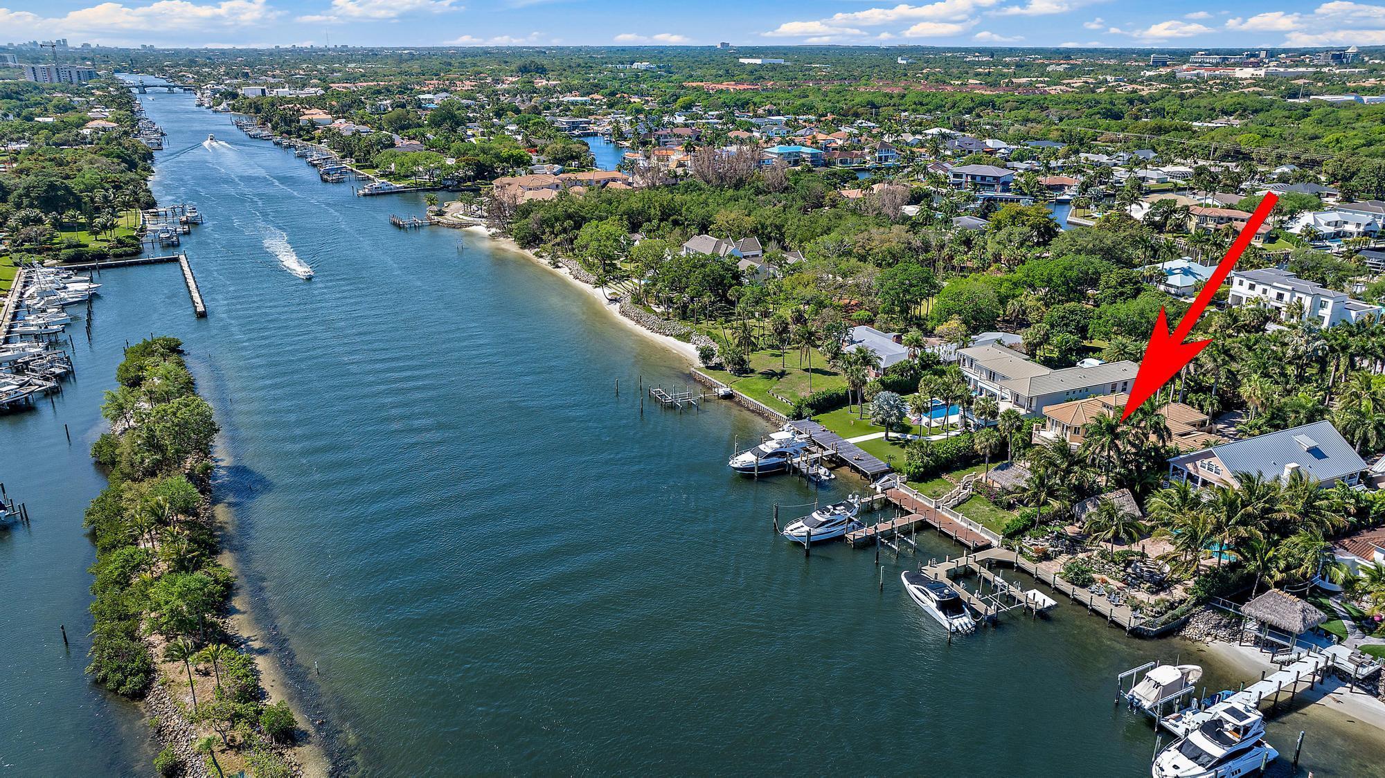 Waterfront living at its finest! Seize the opportunity to live on the Intracoastal Waterway and create your dream home! 75 feet of waterfrontage on 0.65 acres. This prime waterfront property offers endless possibilities- renovate the existing home or build a custom estate. Featuring a DEEP-WATER DOCK that accommodates a 60-foot vessel plus an additional boat lift, this boater's paradise provides OCEAN ACCESS WITH NO FIXED BRIDGES. A gated entry ensures both privacy and security. Don't miss out on this rare chance to own a piece of paradise!