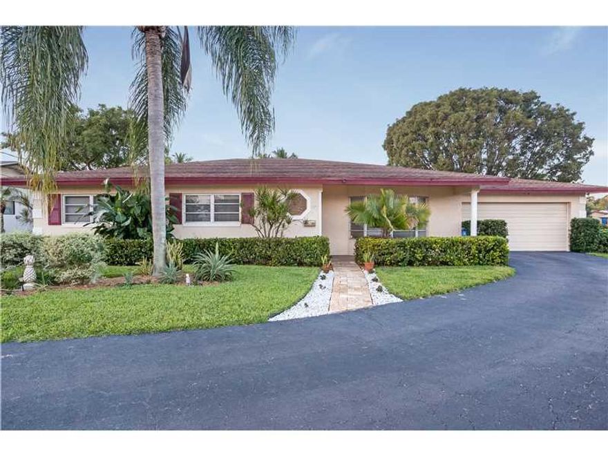 APPRAISERS SEE BROKERS REMARKS This is the perfect house for entertaining and enjoying the south Florida lifestyle! Enjoy views of the pool and extra wide canal from the kitchen, living/dining room and master bedroom! Unique point lot has water on three s ides, private dock with ocean access for small boats. You will love the space and convenience of a full two car garage. Enjoy spectacular sunsets in the evenings from your screened in patio!  Large master bedroom. Plenty of closet space throughout.