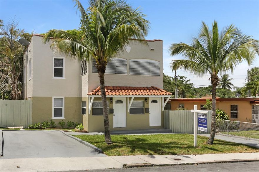 Completely redone duplex in one of the nicest neighborhoods in West Palm Beach. In the heart of it all, with treelined streets and sidewalks for the kiddos! The top unit has three bedrooms and a large living room, while the downstairs is a two bedroom one bath. This house has an abundance of charm and great curb appeal, with a freshly painted exterior and interior. The garage is set back with a long driveway, with plenty of parking. The fenced in yard has plenty of room for a pool and swing set! BRAND NEW white shaker cabinets, quartz counter tops and stainless steel appliances, blinds and lighting, make this a great MOVE IN ready place for you to move in to and rent the other unit. Separate GAS, WATER and ELECTRIC meters! CENTRAL A/C.