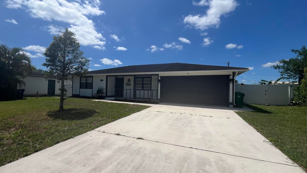 Photo of 574 NW Marion Avenue, Port Saint Lucie, FL 34983 (MLS # R11089640)