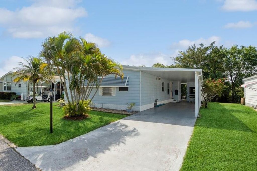 Photo of 8569 Florence Drive, Port Saint Lucie, FL 34952 (MLS # R10965313)