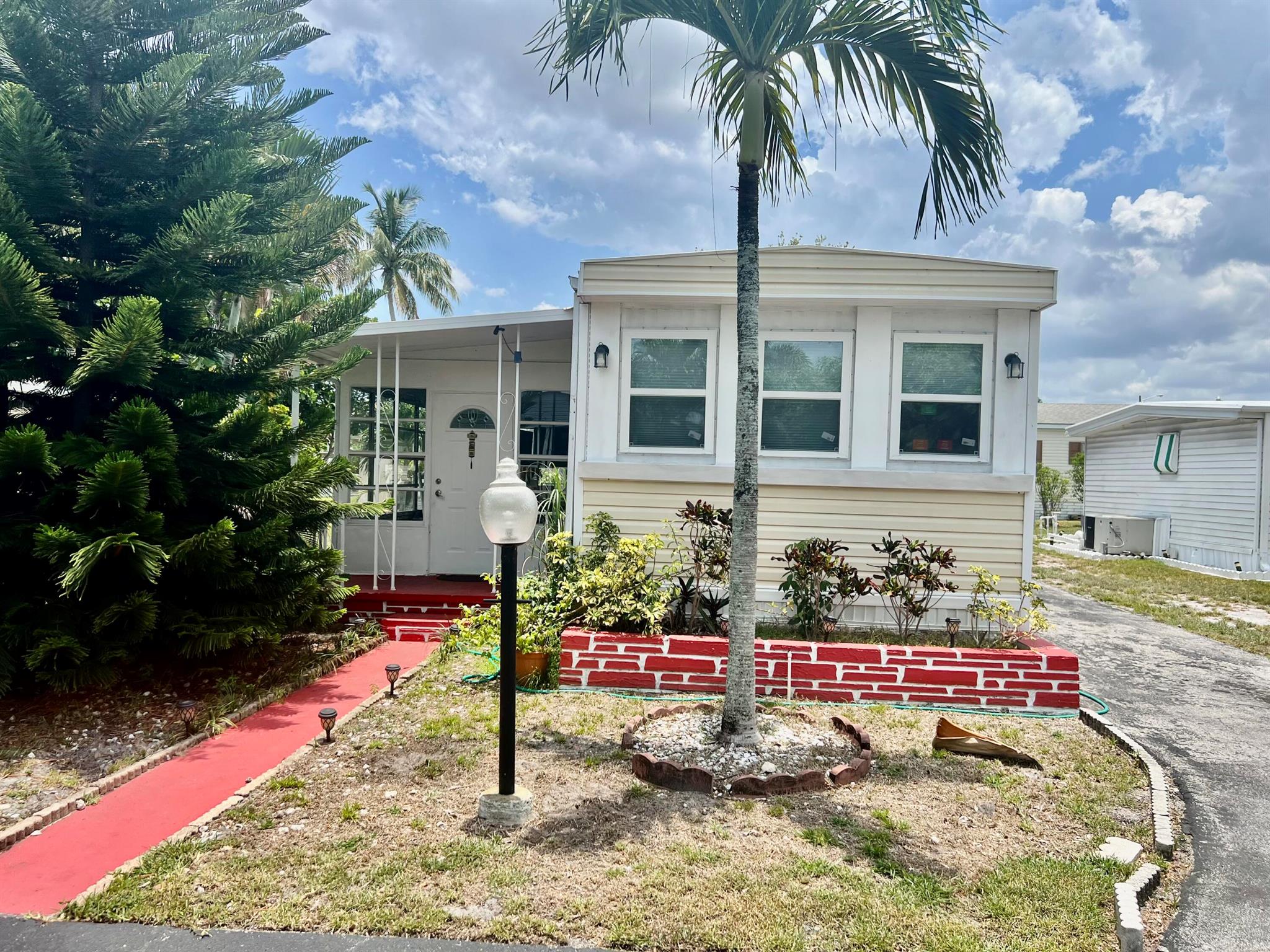 THIS IS A BEAUTIFUL 2/2 NO LAND INCLUDED. COMPLETED RENOVATED. LOCATED WITHIN A PEACEFUL AND GATED COMMUNITY 55+ COMMUNITY. IF OFERS GREAT COMFORT AND SERENITY. THE LOT RENTAL IS $1,106.00 PER MONTH WHICH INCLUDES: TRASH REMOVAL, LAWN CARE, PEST CONTROL AND WATER.