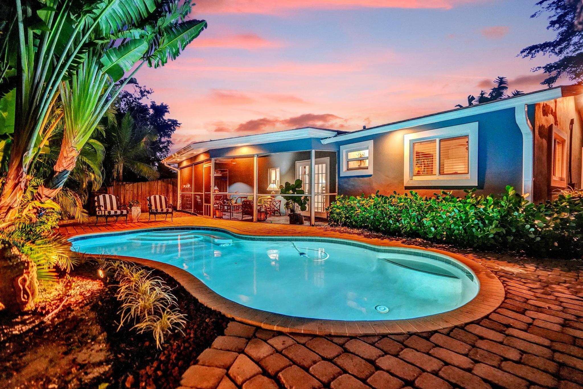 Waterfront Oasis with Saltwater Pool & Modern Updates. Tucked away on a quiet cul-de-sac, this beautifully remodeled home offers peace and privacy just minutes from Wilton Drive, the beach, downtown, and I-95. Enjoy a 2015 renovation featuring a new roof, impact-rated windows/doors, and stylish finishes throughout. The saltwater pool, screened lanai, expansive patios, and lush landscaping create a private outdoor haven perfect for relaxing or entertaining. Surrounded by mature trees and water views, this move-in-ready retreat blends tranquility with unbeatable convenience—just 3 airports away from anywhere you want to go. You could stay closer to home with vibrant South Beach 30 miles south or tony Palm Beach 40 miles north. Experience this home in person - book your appointment today.