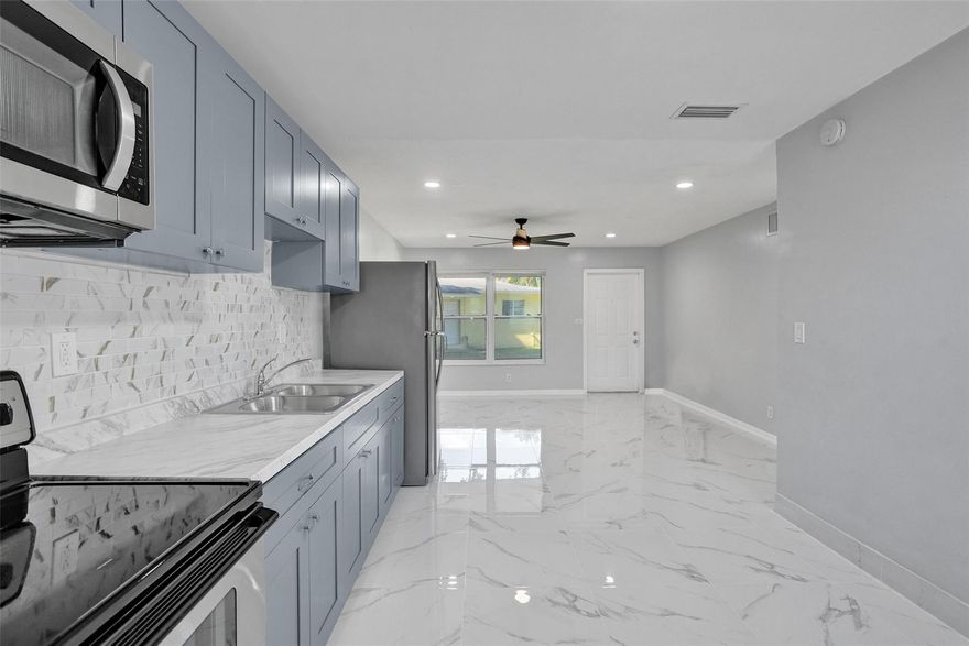 BOTH UNITS FULLY UPDATED IN MODERN STYLE! Turnkey duplex in Oakland Park featuring two spacious 2/1 units renovated this year with sleek contemporary finishes. Each unit offers central A/C, separate electric and water meters, in-unit washer/dryer, updated kitchens, modern baths, and private fenced yards. Covered patio enhances outdoor living and long-term tenant appeal. Rear unit is vacant—perfect for an owner-occupant or immediate market-rate rental. FHA financing available with as little as 3.5% down. Located minutes from top schools, parks, shopping, dining, and major highways. Close to Fort Lauderdale Beach, ensuring strong rental demand year-round. A rare, high-performing income opportunity in a rapidly growing and highly desirable community with continuous appreciation.