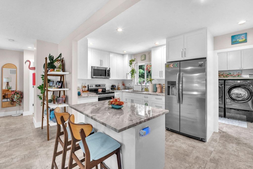 Photo of 80 NE 26th Street, Wilton Manors, FL 33305 (MLS # B26049970)