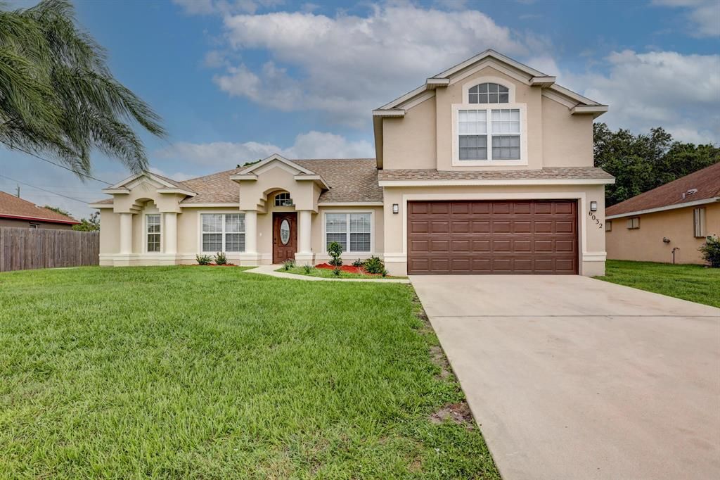 Photo of 6032 NW Wolverine Road, Port Saint Lucie, FL 34986 (MLS # R10730816)
