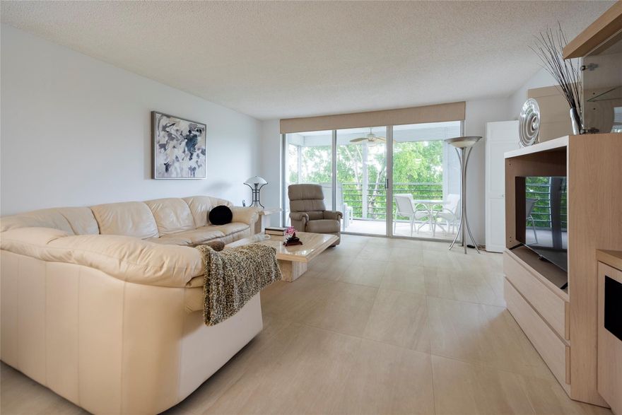 RARELY AVAILABLE PENTHOUSE CORNER UNIT - 3 BEDROOM/2 BATH RENOVATED UNIT WITH WOOD KITCHEN CABINETRY, WHITE QUARTZ COUNTERS AND WHITE NEWER APPLIANCES, NEUTRAL FLOOR TILING THROUGHOUT, BATHS UPGRADED WITH NEW VANITIES AND UPGRADED WALL TILING.  MASTER BATH HAS COMBO TUB AND SHOWER, GUEST BATH A STALL SHOWER.  LARGE LIVING/DINING AREA LEADING TO A SCREENED BALCONY WITH GOLF COURSE VIEWS.  MASTER BEDROOM IS EXTRA LARGE WITH TWO CLOSETS (ONE A WALK-IN), DRESSING AREA AND BATHROOM.  LIVING ROOM AND GUEST BEDROOM HAVE LARGE SLIDING DOORS FOR EXTRA LIGHT.  FURNITURE NEGOTIABLE, PARKING SPOT IS ADJACENT TO THE FRONT ENTRANCE, A/C IS 2-3 YEARS OLD.  PET FRIENDLY COMMUNITY WITH 2 RECREATION AREAS.  NEIGHBORHOOD LOCATED ON A CUL-DE-SAC WITH LUSH VEGETATION AND QUIET LIVING.