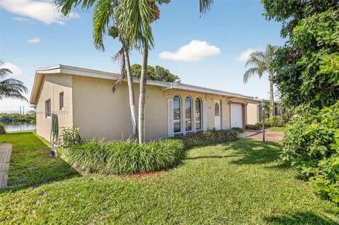 Photo of 4890 NW 14th Terrace, Deerfield Beach, FL 33064 (MLS # B26063209)