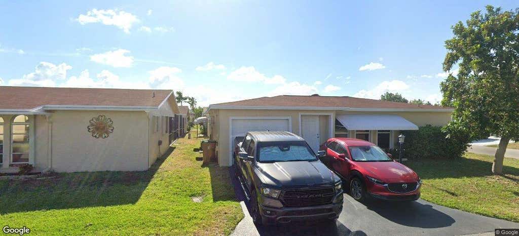 Photo of 4890 NW 14th Terrace, Deerfield Beach, FL 33064 (MLS # B26063209)