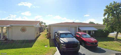 Photo of 4890 NW 14th Terrace, Deerfield Beach, FL 33064 (MLS # B26063209)