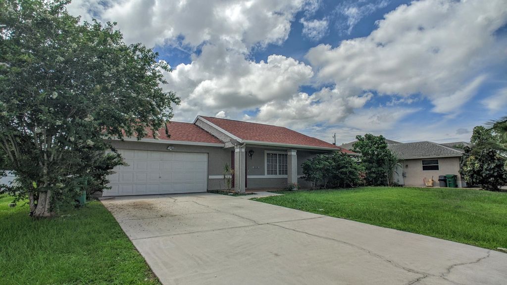 Photo of 1858 SW Davis Street, Port Saint Lucie, FL 34953 (MLS # B26039200)