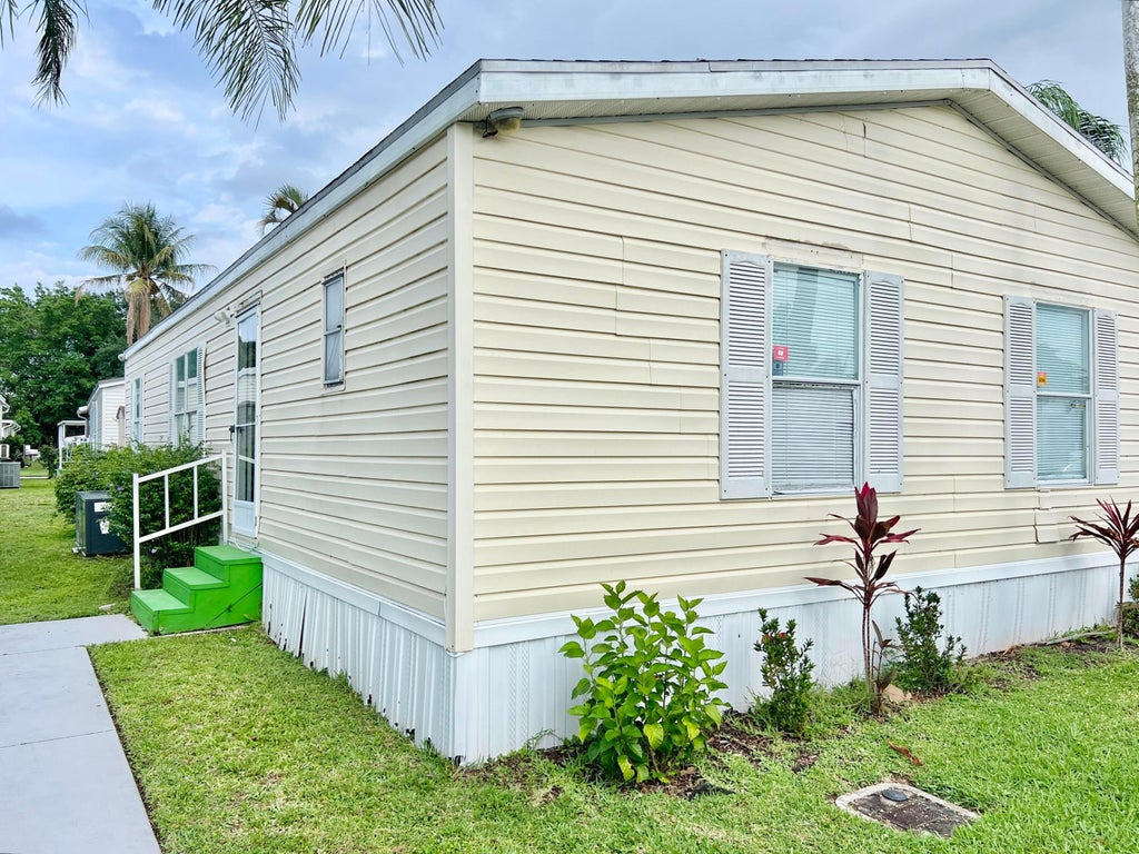 Photo of 183 Plantation Boulevard, Lake Worth, FL 33467 (MLS # B26029475)