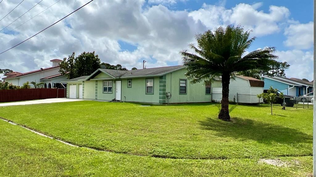 Photo of 1754 SW California Boulevard, Port Saint Lucie, FL 34953 (MLS # R10784048)