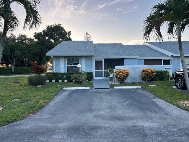 Amazing end unit with no neighbors in this community. Brand New Roof !! All appliances almost new !! Security system installed !! Upgraded electric box just 2-3 years ago. Gorgeous Back yard with huge outdoor patio and a huge screened in patio !! this home was just freshly painted and ready to move right in !! Cathedral ceiling makes the living space so open and amazing !! Washer just a year old !! All tile and laminate flooring through out !! If you enjoy the Beaches just are just a few minutes up the road. Minutes to restaurants and shopping !! There is a 2-pet limit here, up to 25 pounds. This is one of the most amazing and quiet neighborhoods around, just relax and enjoy your home and life !! This Beautiful home is looking for a new owner !! If you are that owner, please call.
