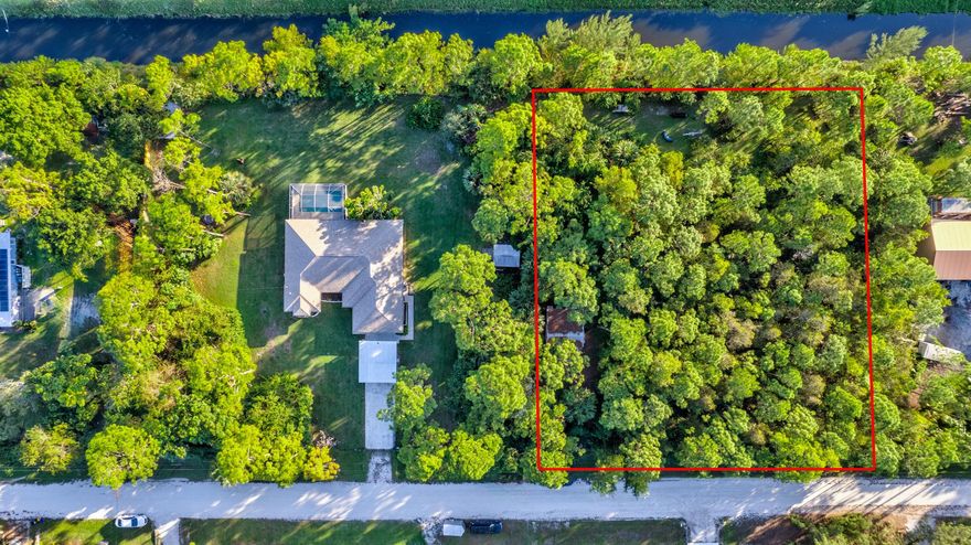 A prime opportunity to build your dream home on this 1.29 acre partially fenced homesite with a convenient location only a few lots off paved Apache. Just a short drive to Seminole Pratt offering  shopping, restaurants, local parks and more. There is also a utility building/kennel on the property that would be great for storage. The lot backs to a canal and offers the potential of low cost irrigation in the future. Needs some clearing, and no septic, well or dedicated electric at the property as of now. One line of fence between the eastern neighbor is all it would take to be fully fenced. There is already a gated entry in place on the vacant lot.  No trespassing on either neighboring homesites please.