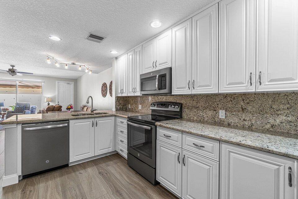 Photo of 4506 Illicium Drive, Palm Beach Gardens, FL 33418 (MLS # B26058580)