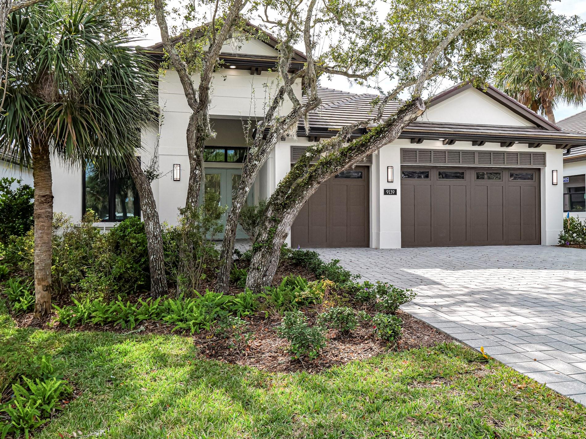 Why wait to build when you can move right in newly built, never lived in home! 3/3/3 + den. Luxury community of Seaglass has Old Florida charm; winding boardwalks among native oak & palm trees. Beach Club membership included, with community room & fitness! Upgrades: plank tile floors, crown molding, Great Room has built-in bar/wine fridge, quartz counters in kitchen/baths, private security system, surround-sound speakers, TV mounts in bedrooms/den/patio, custom-designed master closet, gas heated saltwater pool, pano-view screen enclosure, gas grill hook-up. Garage has AC/epoxy​​‌​​​​‌​‌​​​‌‌​​​‌‌‌​​‌​​‌‌​​​​ floor/storage.