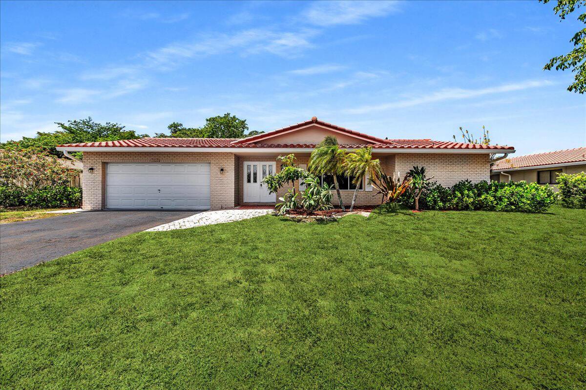 Spacious 5 bed/ 2 bath single-family home in Coral Springs. Great cul-de-sac location with no HOA. Kitchen complete with granite counters, stainless steel appliances, and pass-thru to pool patio. Split floor plan with separate living, dining, and family room--perfect for entertaining. Primary has spacious closet and en-suite bath. New carpet in living area and bedrooms. Freshly painted interior. Brand-new roof for buyer peace of mind. Oversized screened and covered patio. Serene canal view. Fenced yard ideal for pets or play. Convenient 2-car garage and extended drive. Great central location near shops, schools, parks, and thoroughfares.