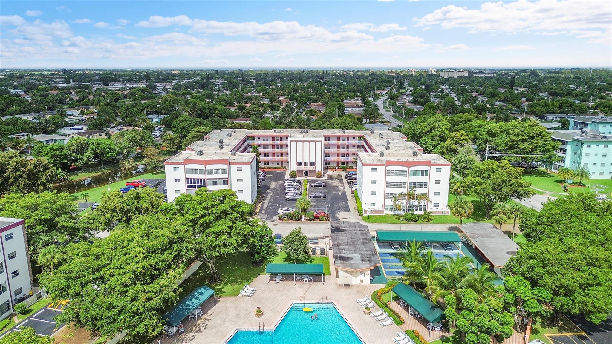 Beautiful move-in ready 2 bedroom 2 bath condo in a 55+ community! BUILDING HAS RESERVES & HAS COMPLETED ITS MILESTONE & STRUCTURAL INTEGRITY RESERVE STUDY. ALL SPECIAL ASSESSMENTS ARE ALREADY PAID! Association requires minimum 20% downpayment & 670 credit score. Can be purchased fully furnished for a turn key move in, or seller would sell unfurnished if you want. The sunroom overlooks the large pool area! Updated kitchen & bathrooms. Enjoy amenities such as the pool, barbecue area, tennis courts, indoor gym, library, billiard room, and party room. Close to shopping centers and dining, as well as I-95 and the Turnpike. Unit is located about 20 minutes from the beach and Fort Lauderdale airport.